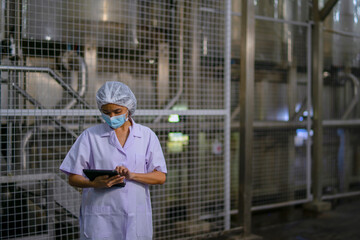 Employee working at canned fish factory.