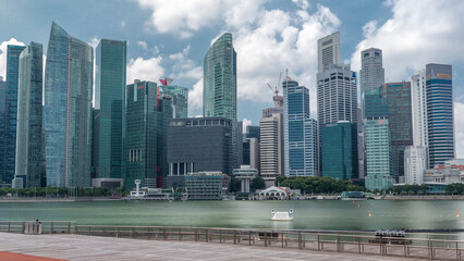 Fototapeta premium Business Financial Downtown City and Skyscrapers Tower Building at Marina Bay timelapse hyperlapse, Singapore,