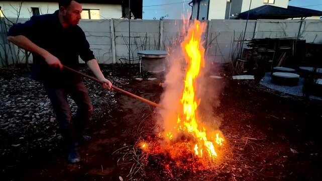 A guy makes fire outside ash danger