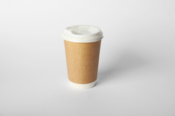 Paper cup with lid on white background. Mockup for design