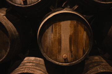 Closeup of Traditional Oak Wine Barrel in a Cellar