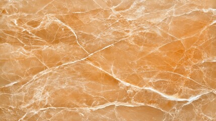 Fototapeta premium A close-up view of a textured orange marble surface showcasing its natural veining and patterns.