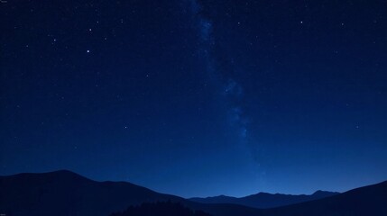 Serene Night Sky Over Silhouetted Mountain Range, A Celestial Panorama of Stars and Galaxies