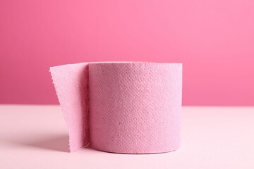 Color toilet paper roll on pink background