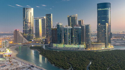 Buildings on Al Reem island in Abu Dhabi day to night timelapse from above. © HyperlapsePro