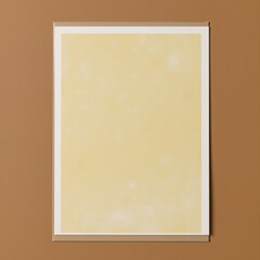 Fototapeta premium Gold-textured abstract pastel background featuring a yellowcream-colored vintage paper look with a golden gradient and a subtle brown base for a unique vintage-inspired website design