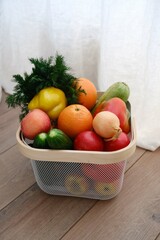 A Beautifully Colorful Selection of Fresh Fruits and Vegetables Arranged in a Basket.