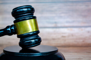 Close up view of lawyer gavel or hammer with customizable space for text, message or ideas. Law and...