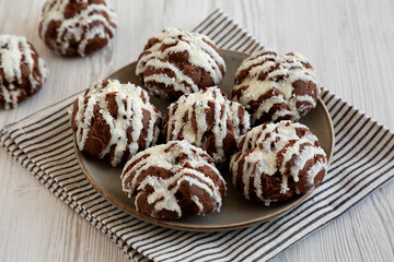 Homemade Profiteroles with Coconut Cream on a Plate, side view.