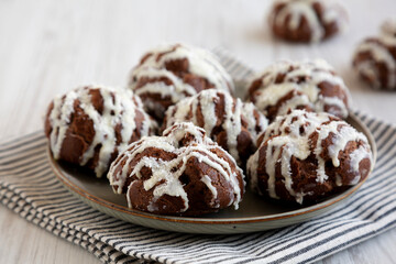 Homemade Profiteroles with Coconut Cream on a Plate, side view.