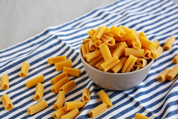 Homemade Raw Heart-Shaped Rigacuore Pasta in a Bowl, side view.