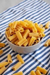 Homemade Raw Heart-Shaped Rigacuore Pasta in a Bowl, side view.