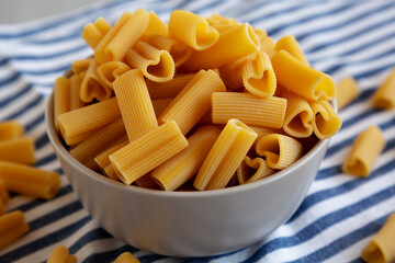 Homemade Raw Heart-Shaped Rigacuore Pasta in a Bowl, side view.