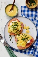 Eggs Benedict with Ham on a Plate for Breakfast.  .Healthy appetizer.