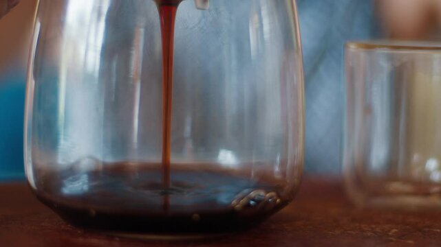 Woman drinks dark pu erh tea from the thermal double wall glass