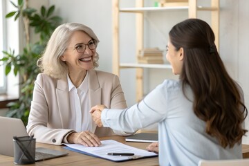 Young happy professional work team of two diverse confident female and male partners employees business people man and woman standing together in office looking at camera, corporate portrait.