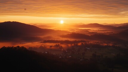 Fototapeta premium Sunrise over misty mountains (1)