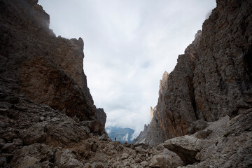Majestic rock formations in the Sassolungo mountains of the Dolomites during an overcast day