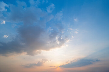 sunset / sun rise sky with rays of light shining clouds and sky background and texture