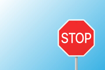 Road sign STOP on blue sky background
