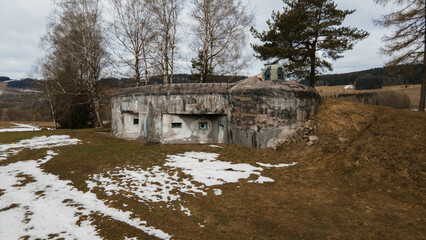 An aerial view of a historic Czechoslovak military bunker near Lichkov, nestled in a wintery...