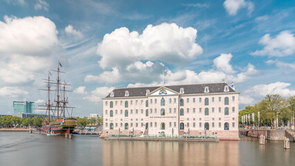 Hyperlapse of the National Maritime Museum with the sailboat replica Amsterdam docked nearby. Amsterdam, Netherlands