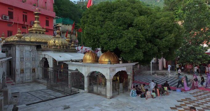 Aerial approach toward the golden dome of Jawalamukhi Jwala Ji Temple main shrine in Kangra, Himachal Pradesh, sacred Hindu Shakti Peeth pilgrimage site in India