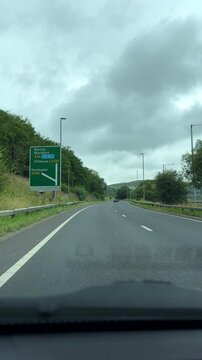 Vertical video. Driving road A56 to direction of Blackburn, Burnley and Clitheroe, car dashboard view.