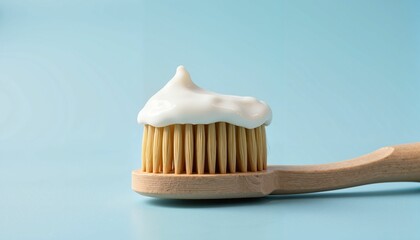 Toothbrush with toothpaste on blue background
