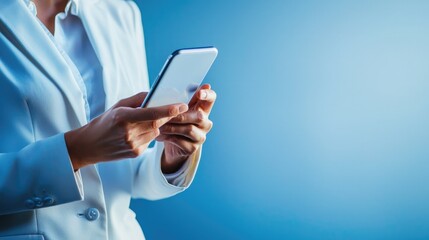 A confident person holding a smartphone against a clean blue gradient. 