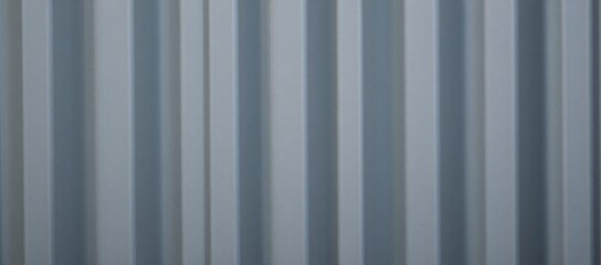 Obraz premium A weathered metal zinc fence with a distressed corrugated surface serves as a backdrop for the scene