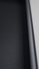 Close-up view of black textured plastic material