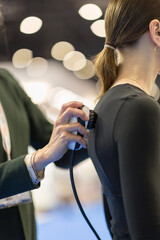 Physiotherapy Handpiece in Use on Female Patient