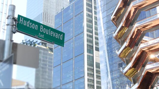 New York City, United States. Hudson Yards urban architecture in Chelsea, Manhattan Midtown, NYC, USA. New modern high-rise glass skyscrapers, american business buildings and real estate. Road sign.