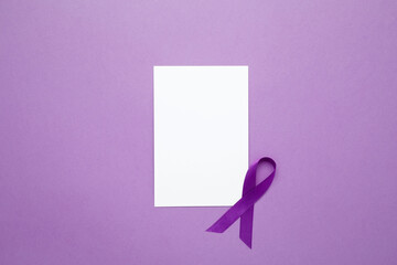 Purple Epilepsy Awareness Day, purple ribbon held, symbol of support. Mock up notebook