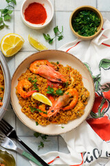 Traditional Spanish paella with seafood in a frying pan. .top view