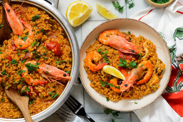 Traditional Spanish paella with seafood in a frying pan. .top view