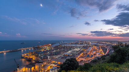 Seaport and loading docks at the port with cranes and multi-colored cargo containers day to night timelapse
