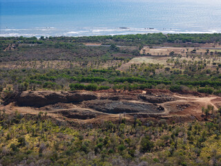 Fototapeta premium Landscape showing coastal area and excavation site near body of water