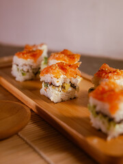 Homemade Square Sushi on Wooden Plate