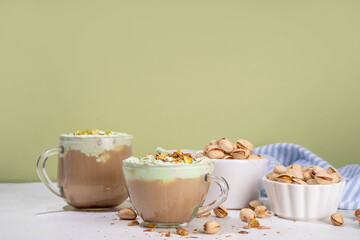 Vegan pistachio milk coffee latte. Iced and hot coffee drinks with plant based whipped pistachio creamer, copy space