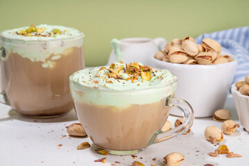 Vegan pistachio milk coffee latte. Iced and hot coffee drinks with plant based whipped pistachio creamer, copy space