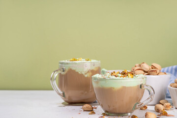 Vegan pistachio milk coffee latte. Iced and hot coffee drinks with plant based whipped pistachio creamer, copy space