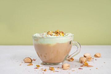 Vegan pistachio milk coffee latte. Iced and hot coffee drinks with plant based whipped pistachio creamer, copy space