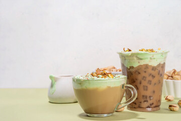 Vegan pistachio milk coffee latte. Iced and hot coffee drinks with plant based whipped pistachio creamer, copy space