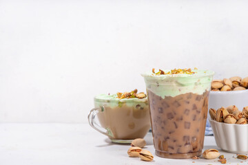 Vegan pistachio milk coffee latte. Iced and hot coffee drinks with plant based whipped pistachio creamer, copy space