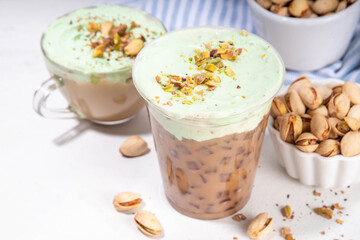 Vegan pistachio milk coffee latte. Iced and hot coffee drinks with plant based whipped pistachio creamer, copy space