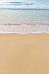 Sea wave water on the sand beach at the morning time.