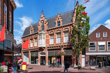 Fototapeta premium Shopping street in Sneek with traditional buildings on a sunny day in summer,Netherlands