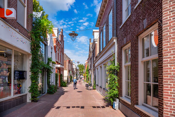 Narrow street in Sneek with historical buildings, Netherlands